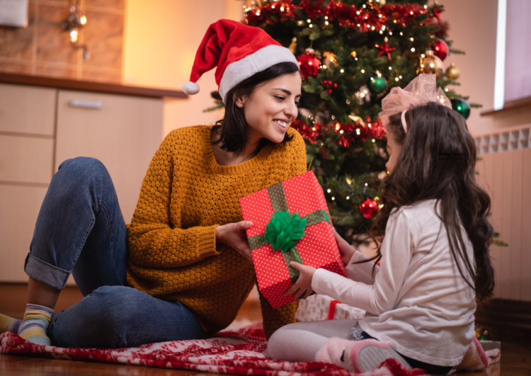 giving Christmas gift to child