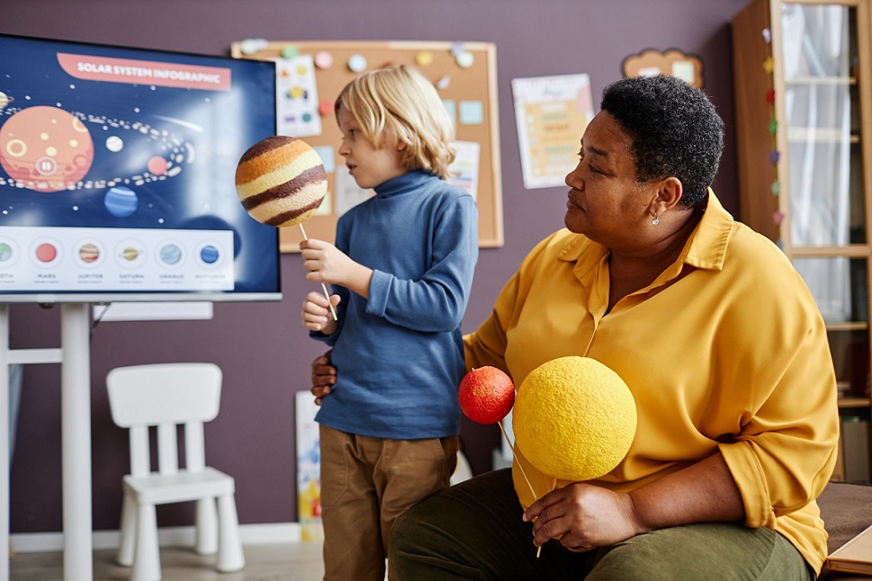 kid and woman learning about solar system