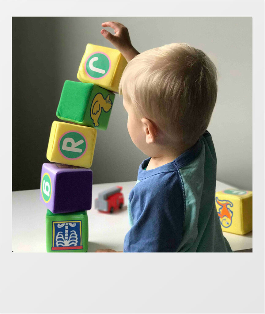 kid playing with blocks