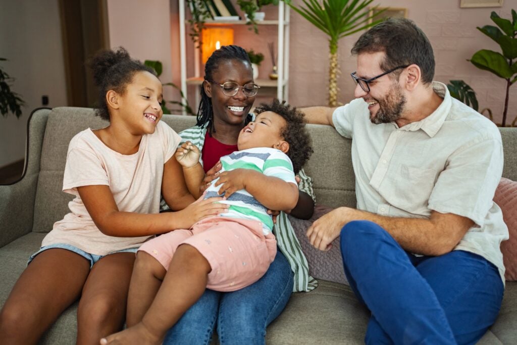 Family joy in a cozy living room on a sunny afternoon